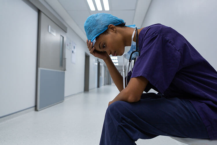 Tired Nurse in Hospital